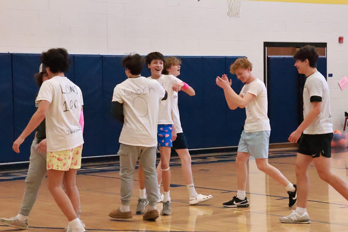 Team+captain+Dom+Marcini+celebrates+with+freshman+teammates+after+their+dodgeball+victory+over+the+teachers.+The+dodgeball+championship+game+was+played+during+intervention+March+15.
