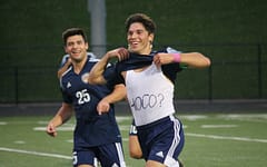 Sophomore Vince Incorvati looks on as his brother, senior Dom Incorvati, invites his girlfriend to Homecoming after scoring a goal at home.