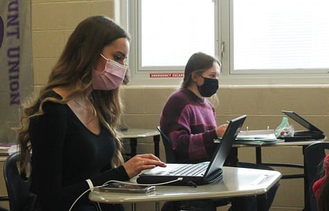 Working during ASP in Alexandra Klobusniks room are junior Aspen Hanzak and sophomore Megan Solly. Both girls are wearing masks, as is the dress code requirement for all students and staff this school year in an effort to stop the spread of COVID-19.
