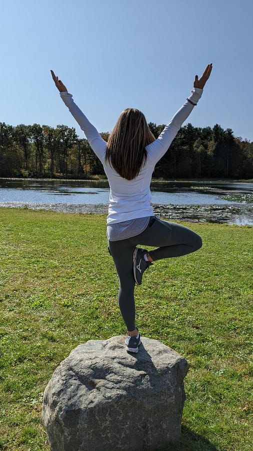 In this photo, Romance is doing the pose Vrikshasana or better known as the Tree Pose.  One benefit of the Tree Pose is strengthens legs and opens hips.