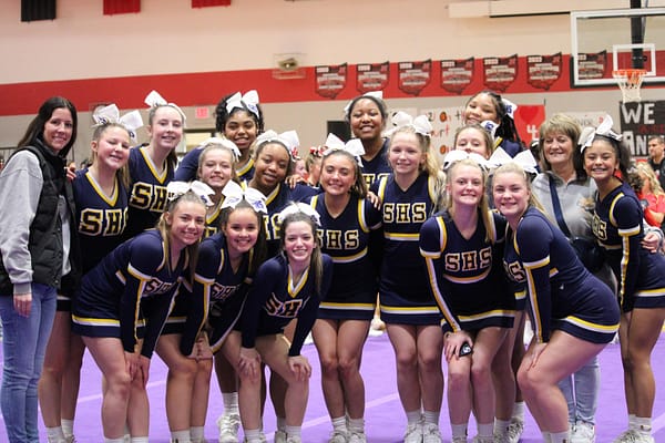 JV and Varsity cheerleaders celebrate their third place win at Norton High School Feb. 11.  The girls performed a dance, cheer, chant and the school fight song.