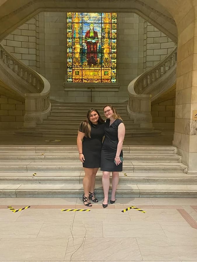 Senior Ali Madden captures a moment with her cousin, Sam Madden, at the Portage County Court of Appeals. Since Ali Madden is pursuing a degree in law, her cousin helped set up this experience to shadow a judge.