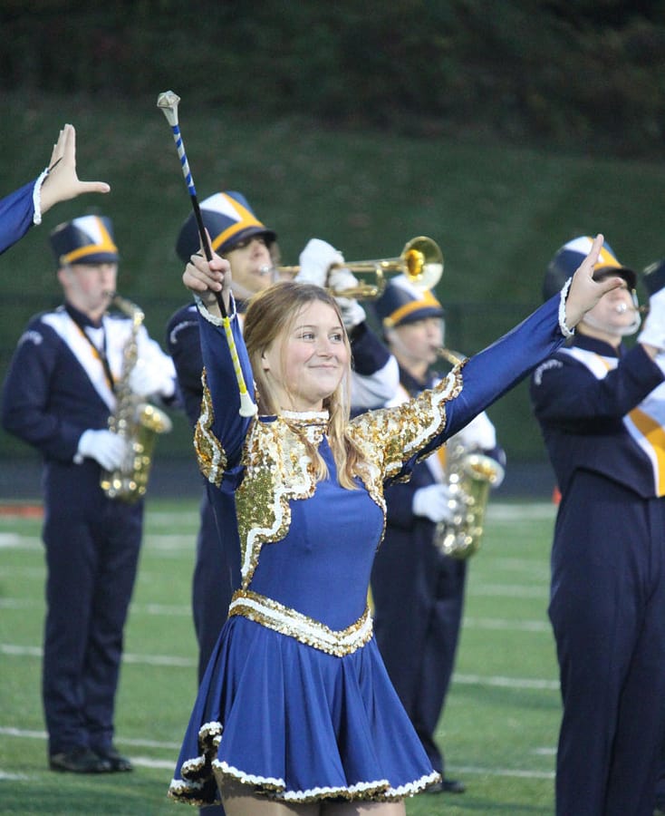 Junior auxiliary member Destiny Ward performs during the halftime show at a Friday night football game.