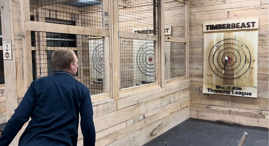 Math teacher Ryan Spence gets a  bullseye during his first visit to TimberBeast Axe Throwing. the venue recently opened in Streetsboro.
