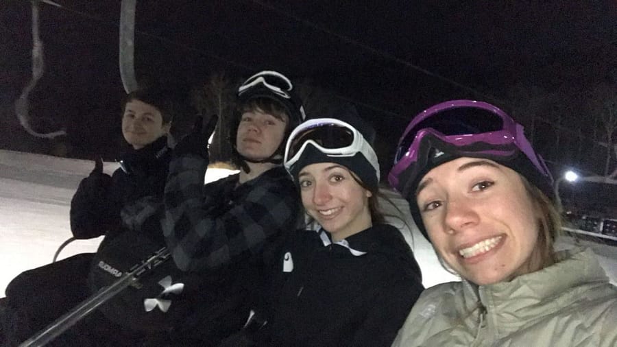 Senior Delaney Maglionico and sophomores Sophia Maglionico and Tyler Paul ride the ski lift up the slopes.