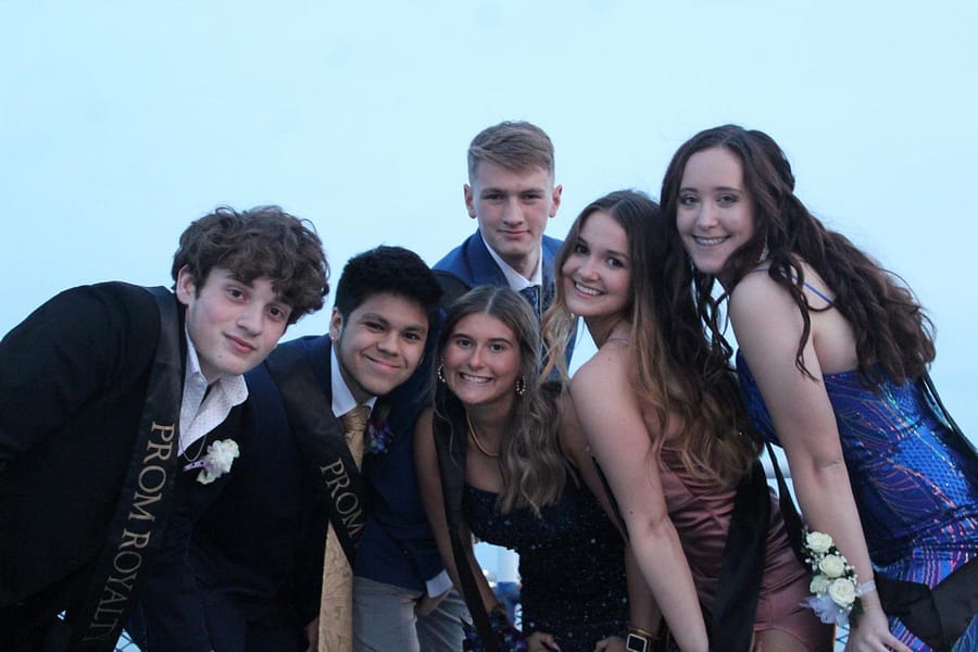 Senior prom court members hang out on the upper deck of the Goodtime III before the announcement of King and Queen. They are Garret Kelly, Colin Agra, Ethan Schuster, Alli Hoffman, Vivian Hall and Kaylee Christine.