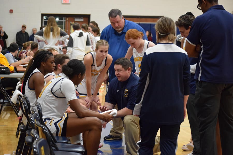 Coach Singer talking to his team during a timeout. 