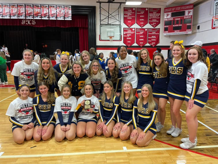 The combined large squad of Rocket JV and Varsity cheerleaders teamed up to take second place at the MAC cheer competition held at Field Feb. 6.